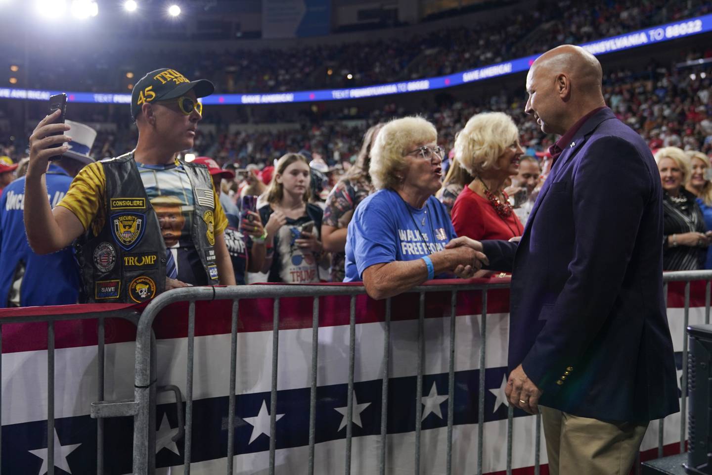 Pennsylvania Republican gubernatorial candidate Doug Mastriano, right, greets supporters before former President Donald Trump speaks at a rally in Wilkes-Barre, Pa., Saturday, Sept. 3, 2022. (AP Photo/Mary Altaffer)