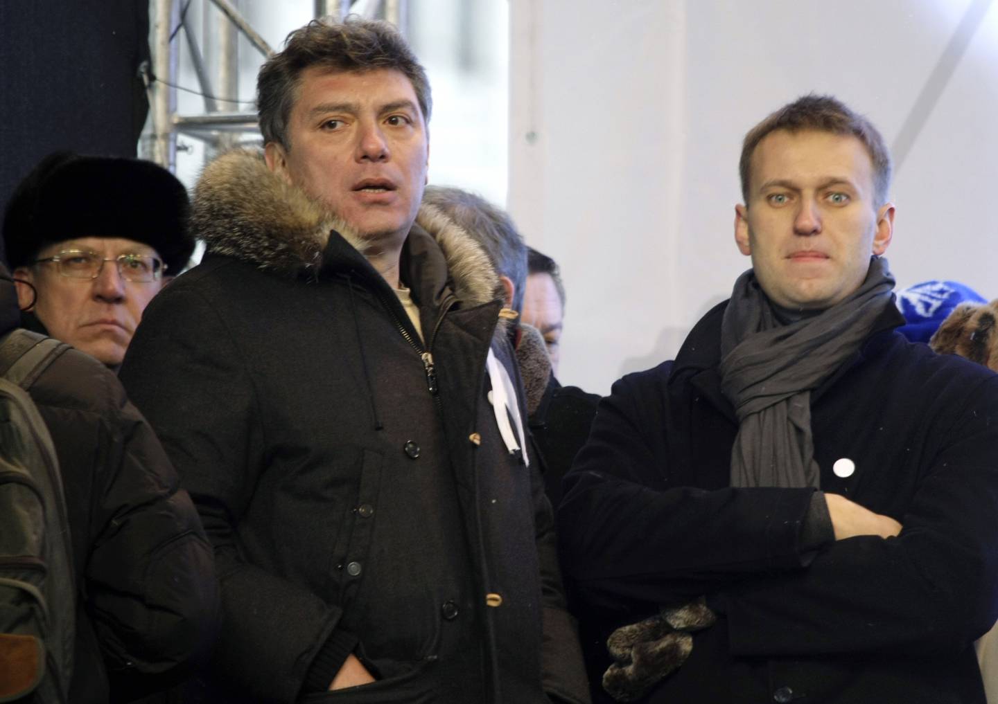 FILE - From left, Russian former Financial Minister Alexei Kudrin, leaders of the opposition Boris Nemtsov and Alexei Navalny attend a rally to protest alleged vote rigging in Russia's parliamentary elections on Sakharov avenue in Moscow, Russia on Dec. 24, 2011. Russia’s prison agency says that imprisoned opposition leader Alexei Navalny has died. He was 47. The Federal Prison Service said in a statement that Navalny felt unwell after a walk on Friday Feb. 16, 2024 and lost consciousness. (AP Photo/Misha Japaridze, File)