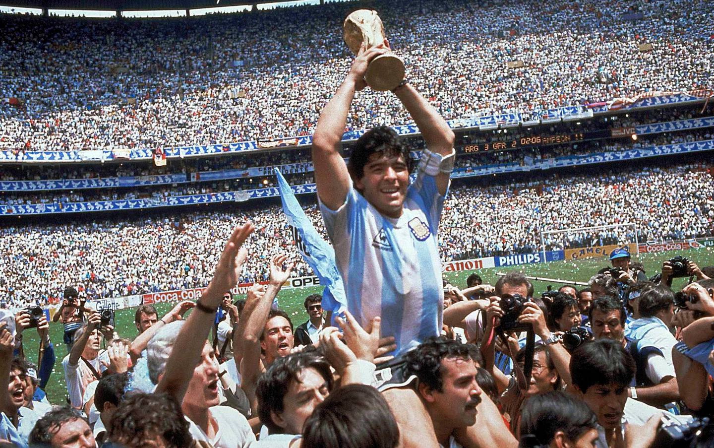  ** ADVANCE FOR WEEKEND EDITONS, MAY 29-30 **  FILE - In this June 29, 1986 file photo, Diego Maradona of Argentina, is lifted up as he holds the World Cup trophy after Argentina defeated West Germany 3-2 in the World Cup soccer final in the Atzeca Stadium, in Mexico City. (Ap Photo/Carlo Fumagalli, File)