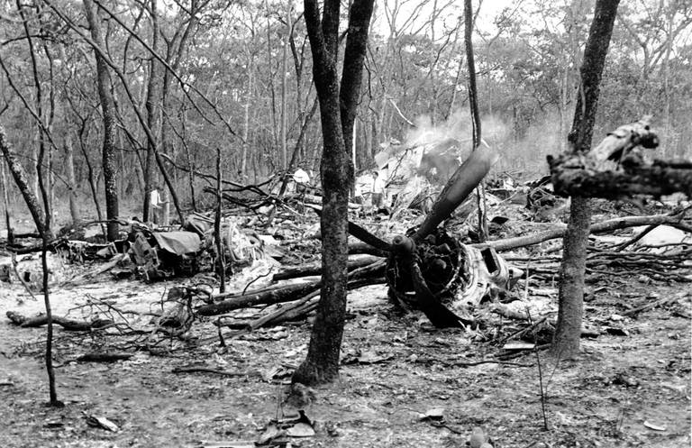 This is a general view of men searching the site of the plane wreckage near Ndola, Zambia on Sept. 19, 1961.  Passenger U.N. Secretary General Dag Hammarskjold was en route to a meeting with Katanga's President Moise Tshombe to negotiate the Congo crisis at Ndola when his plane crashed in a forest near the city on Sept. 18.  (AP Photo)