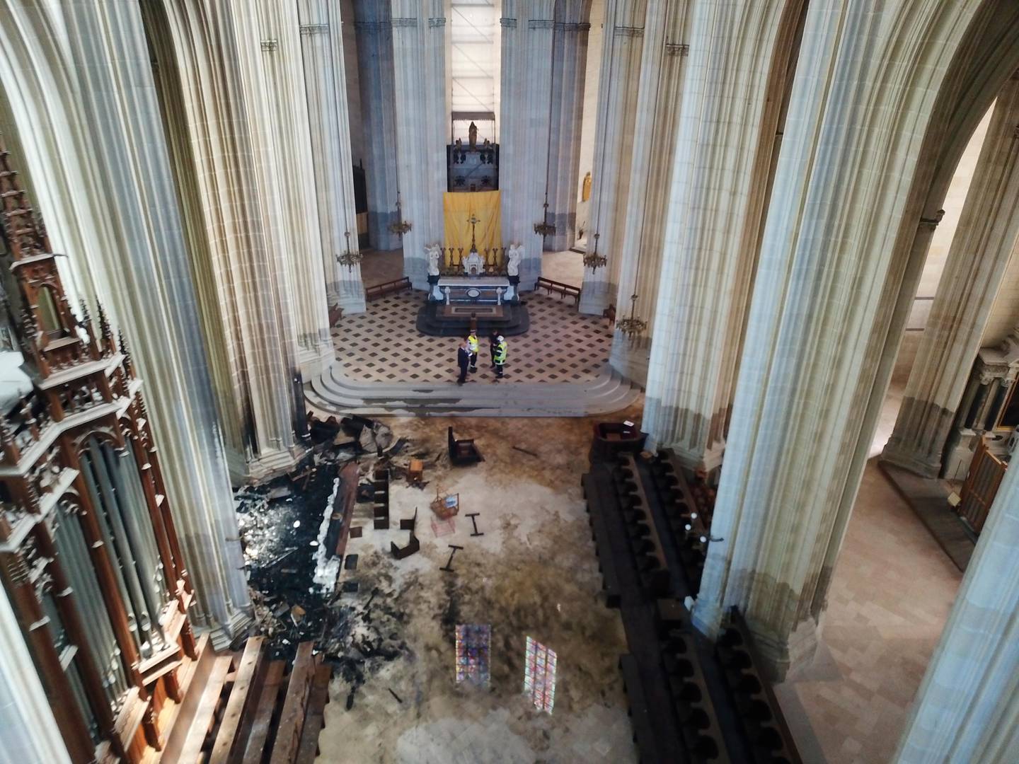 This image provided by SDIS 44 Department of Fire and Rescue, shows the inside of the Gothic St. Peter and St. Paul Cathedral after the blaze in Nantes, western France, Saturday, July 18, 2020. French officials launched an arson inquiry Saturday after the fire broke out destroying the organ, shattered stained glass windows and sent black smoke spewing from between the cathedral towers. (SDIS 44 Department of Fire and Rescue via AP)