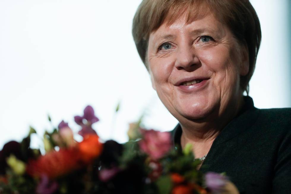German Chancellor Angela Merkel attends a meeting with representatives of a German association of florists and gardeners at the chancellery in Berlin, Germany, Tuesday, Feb. 11, 2020. (AP Photo/Markus Schreiber)