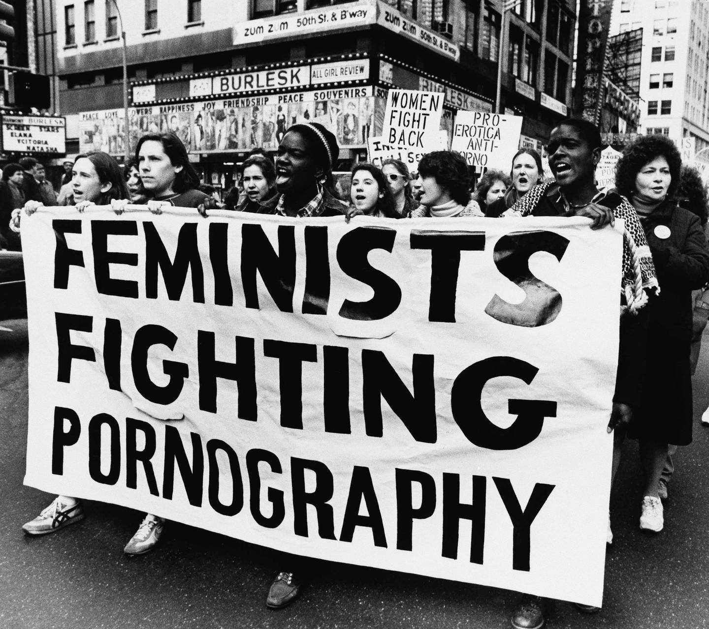 Nearly 200 women and men march through the New York City's Times Square area, April 9, 1984  protesting pornography. The women marched to various peep-show parlors and x-rated theaters in the area, speaking out against what they called the indignity toward women in pornographic films and publications. (AP Photo/Nancy Kaye)
