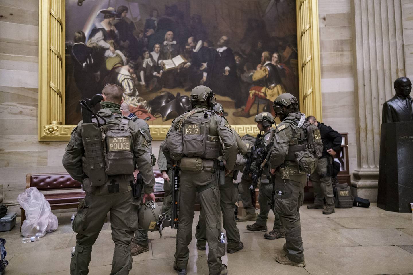 After violent protesters loyal to President Donald Trump stormed the U.S. Capitol today, a tactical team with ATF gathers in the Rotunda to provide security for the continuation of the joint session of the House and Senate to count the Electoral College votes cast in November's election, at the Capitol in Washington, Wednesday, Jan. 6, 2021. (AP Photo/J. Scott Applewhite)