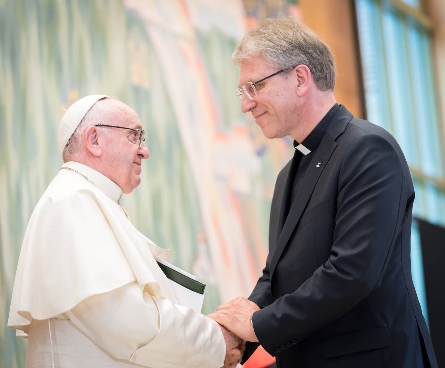 21 June 2018, Geneva, Switzerland: WCC general secretary Rev. Dr Olav Fykse Tveit and Pope Francis share a moment of mutual appreciation after Tveit has spoken at an Ecumenical Encounter between Pope Francis and the World Council of Churches on 21 June. On 21 June 2018, the World Council of Churches receives a visit from Pope Francis of the Roman Catholic Church. Held under the theme of “Ecumenical Pilgrimage - Walking, Praying and Working Together”, the landmark visit is a centrepiece of the ecumenical commemoration of the WCC's 70th anniversary. The visit is only the third by a pope, and the first time that such an occasion was dedicated to visiting the WCC.