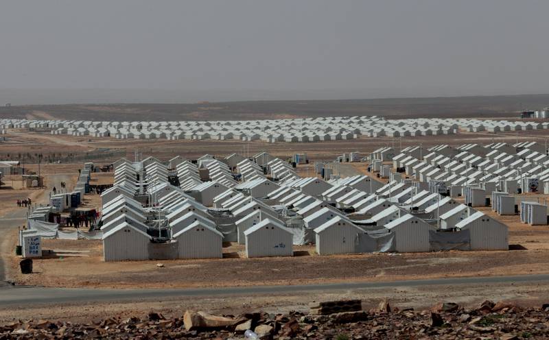 This photo taken Tuesday, March 10, 2015, shows Azraq refugee camp in Azraq, 100 kilometers (62 miles) east of Amman, Jordan. Now entering its fifth year, the Syrian civil war has claimed the lives of more than 220,000 people and displaced nearly half of the country's pre-war population of 23 million. (AP Photo/Raad Adayleh)