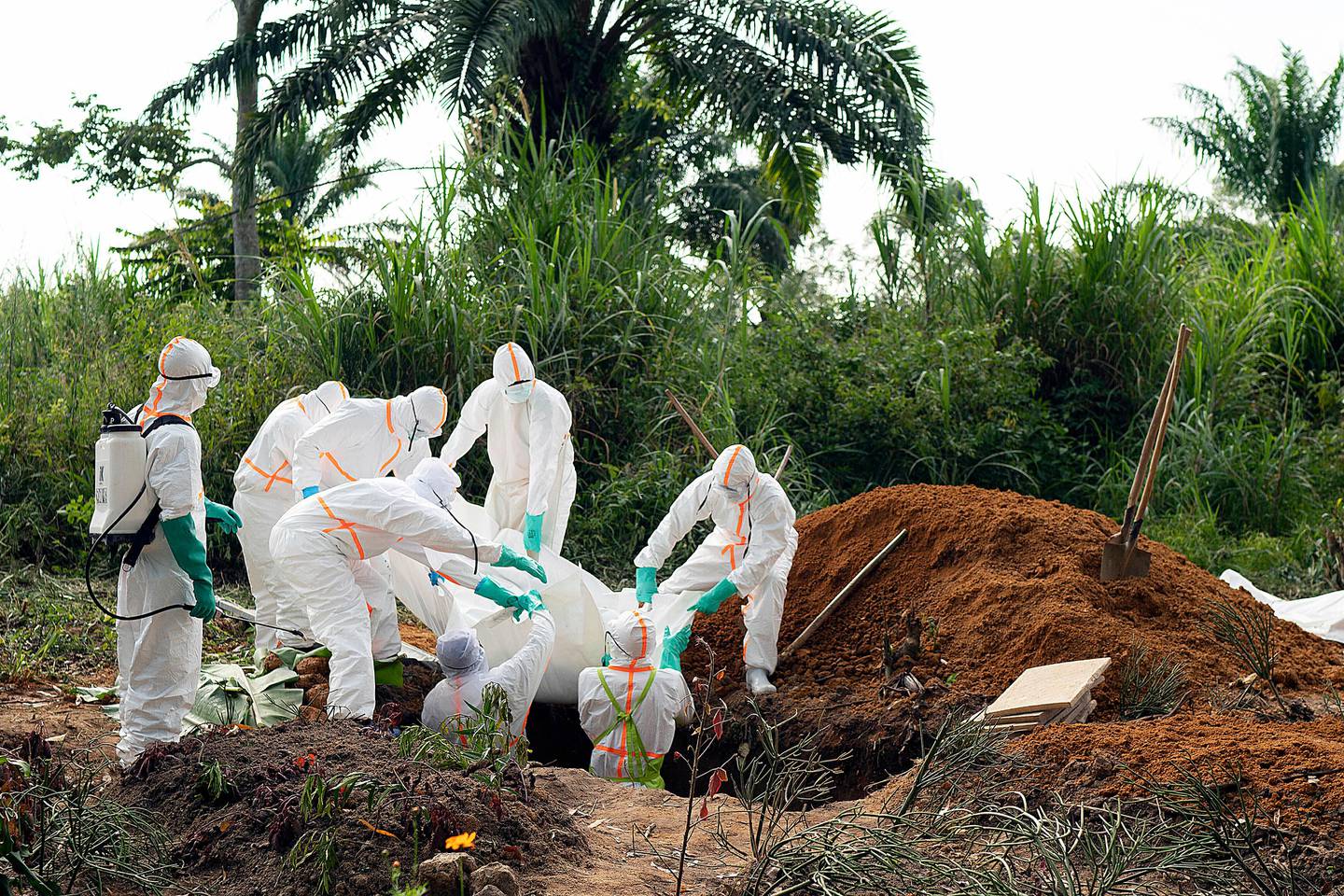 FILE - In this Sunday, July 14, 2019 file photo, an Ebola victim is put to rest at the Muslim cemetery in Beni, Congo. These African stories captured the world's attention in 2019 - and look to influence events on the continent in 2020. (AP Photo/Jerome Delay, File)