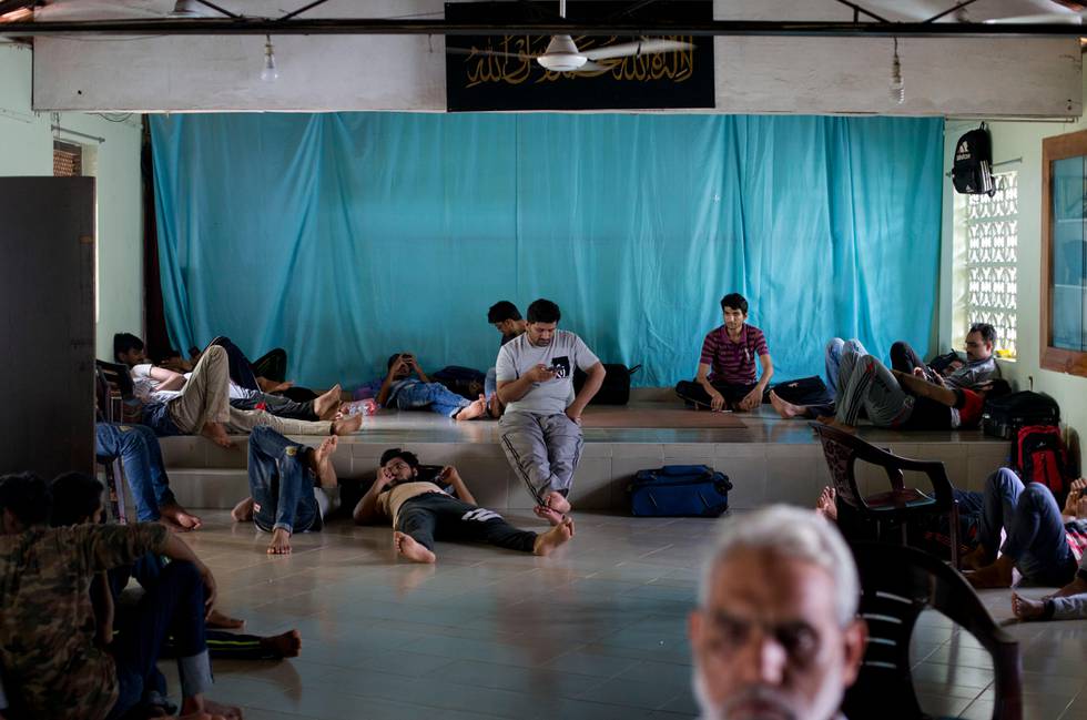 Ahmadi Muslim refugees rest in Ahmadiyya Muslim mosque in Negombo, Sri Lanka, Thursday, April 25, 2019. Hundreds of Ahmadi Muslims from Pakistan who sought refuge in Sri Lanka now huddle together in fear following attacks and harassment after the Easter bombings. They are just some of the Muslims scared the Islamic State-claimed assault will bring both government and mob retaliation. (AP Photo/Gemunu Amarasinghe)