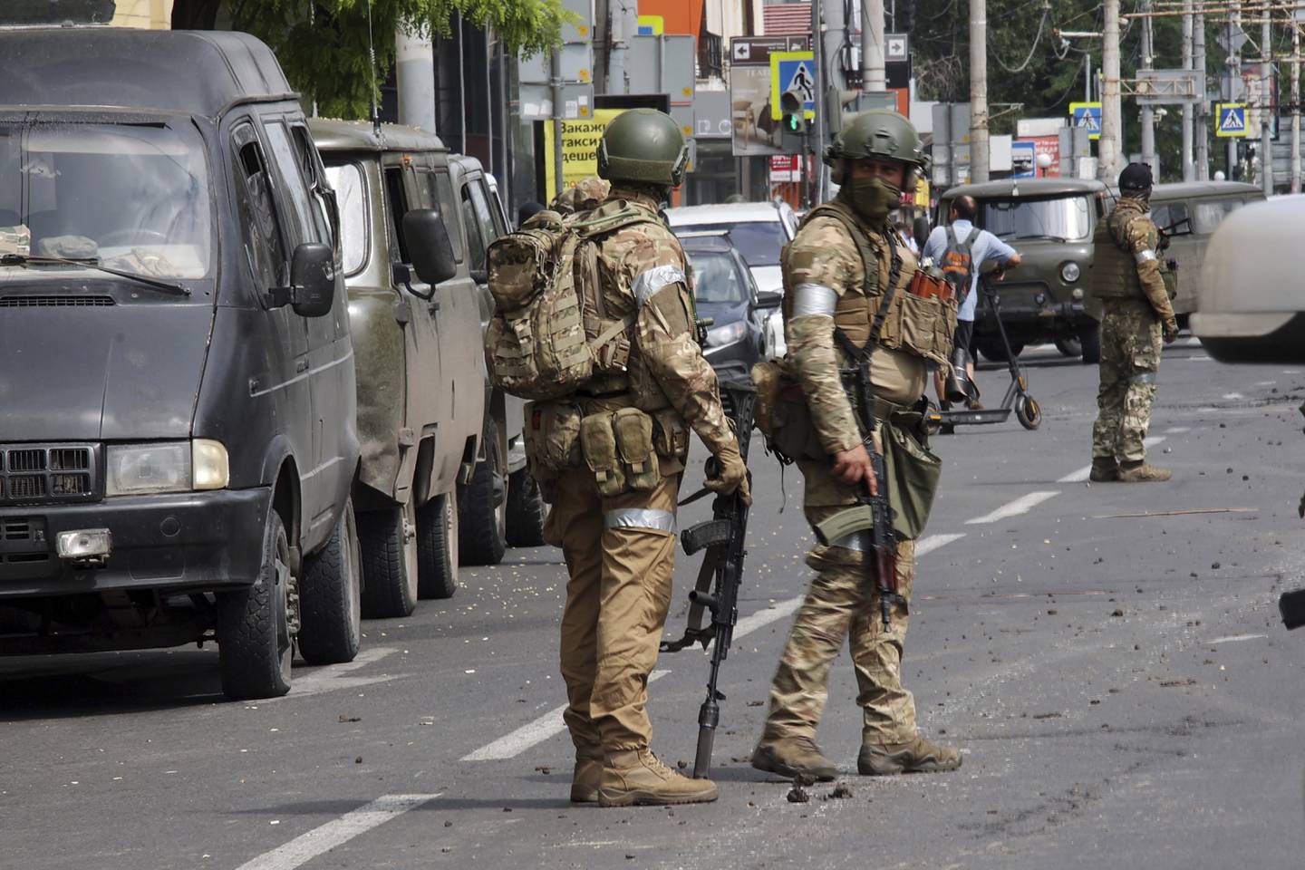 Russian servicemen guard an area in a street in Rostov-on-Don, Russia, Saturday, June 24, 2023. Russia's security services have responded to mercenary chief Yevgeny Prigozhin's declaration of an armed rebellion by calling for his arrest. In a sign of how seriously the Kremlin took the threat, security was heightened in Moscow, Rostov-on-Don and other regions. (Vasily Deryugin, Kommersant Publishing House via AP)