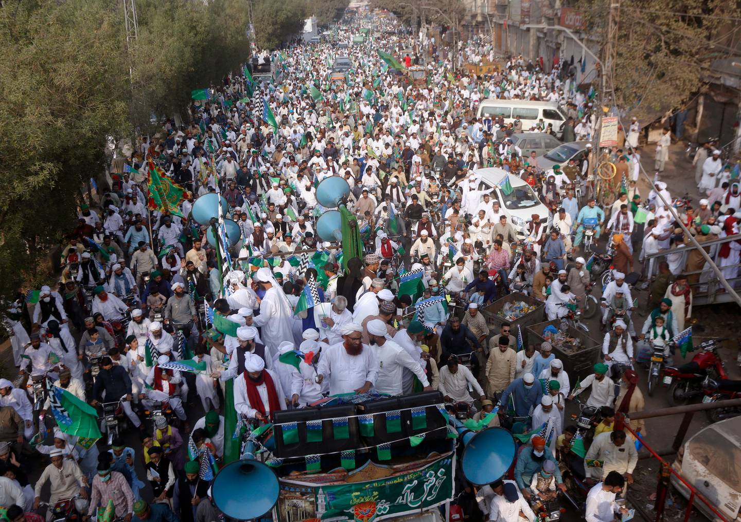 Supporters of religious group take part in a rally against French President Emmanuel Macron and republishing of caricatures of the Prophet Muhammad they deem blasphemous, in Lahore, Pakistan, Friday, Oct. 30, 2020. Muslims have been calling for both protests and a boycott of French goods in response to France's stance on caricatures of Islam's most revered prophet. (AP Photo/K.M. Chaudary)