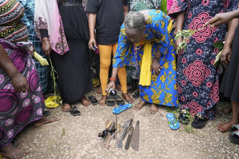 Women protest at a market, following Sunday's church attack at the St. Francis Catholic Church in Owo,Nigeria, Tuesday, June 7, 2022. Before the church attack, Ondo had been considered one of Nigeria's most peaceful states. But now Owo, a small town of traders and government workers located 50 kilometers (31 miles) from the state capital of Akure, is reeling from the violence of the church attack. (AP Photo/Sunday Alamba)