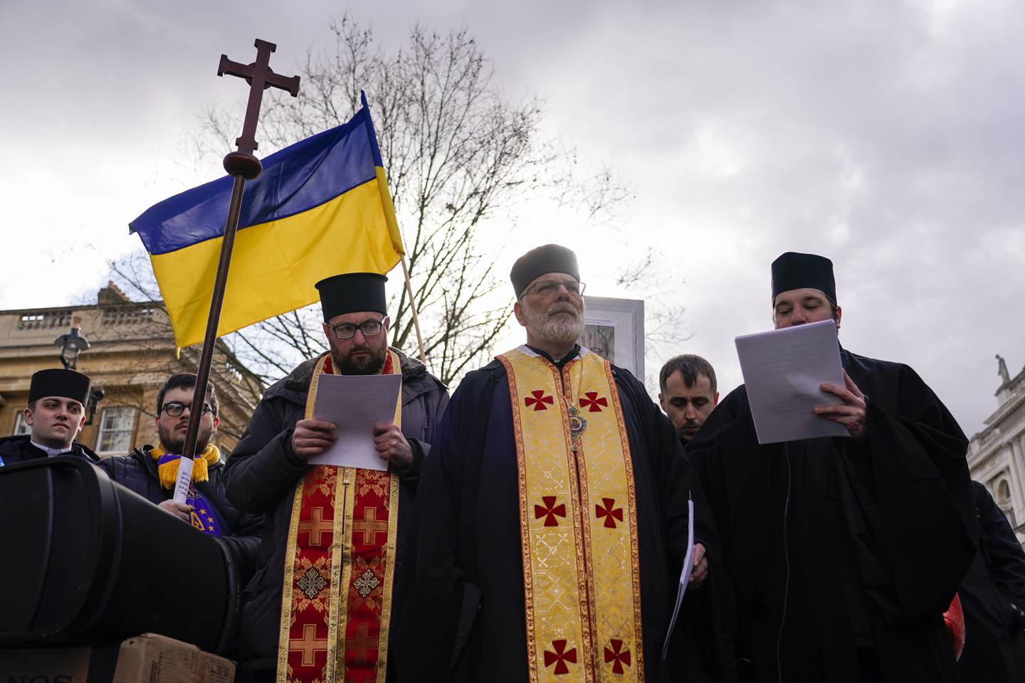Members of the Orthodox Church attend a demonstration outside Downing Street in support of Ukraine, in London, Thursday, Feb. 24, 2022. Russian President Vladimir Putin on Thursday announced a military operation in Ukraine and warned other countries that any attempt to interfere with the Russian action would lead to 'consequences you have never seen.' (AP Photo/Alberto Pezzali)
