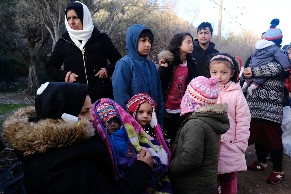 Migrants wait to leave from the village of Skala Sikaminias on the northeastern Aegean island of Lesbos, Greece, on Tuesday, March 3, 2020. Migrants and refugees hoping to enter Greece from Turkey appeared to be fanning out across a broader swathe of the roughly 200-kilometer-long land border Tuesday, maintaining pressure on the frontier after Ankara declared its borders with the European Union open. (AP Photo/Alexandros Michailidis)