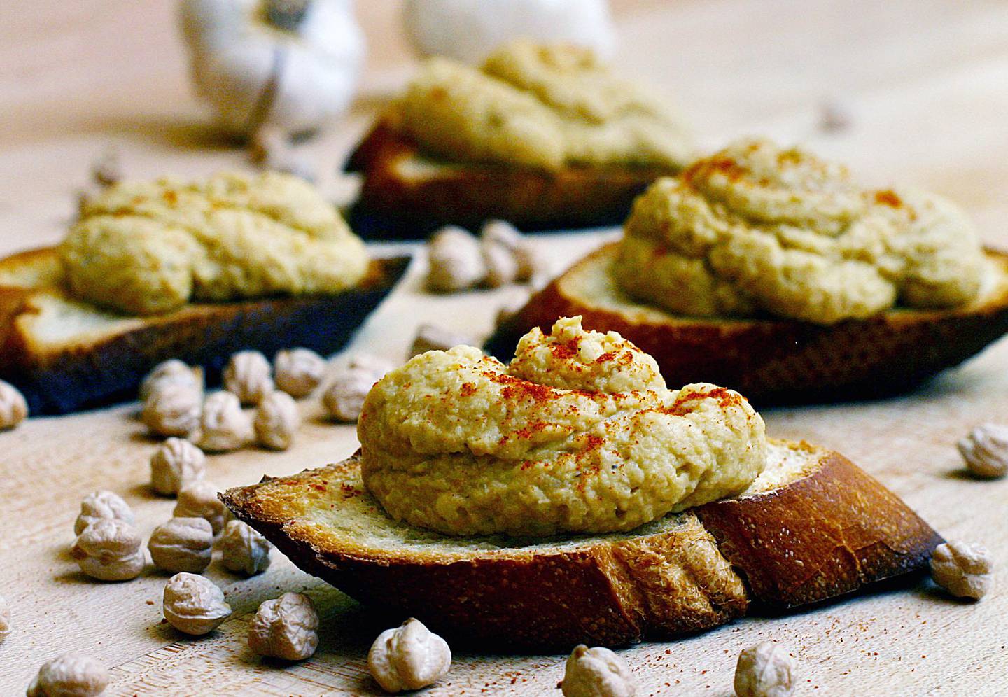 ** FOR USE WITH AP WEEKLY FEATURES **   Rustic Hummus, the result of tinkering with an old favorite, is a version of the basic hummus that for many people is a culinary staple. The recipe includes sesame seeds and chickpeas with lime juice, garlic and honey for flavor, plus a garnish of a dusting of paprika. (AP Photo/Larry Crowe)