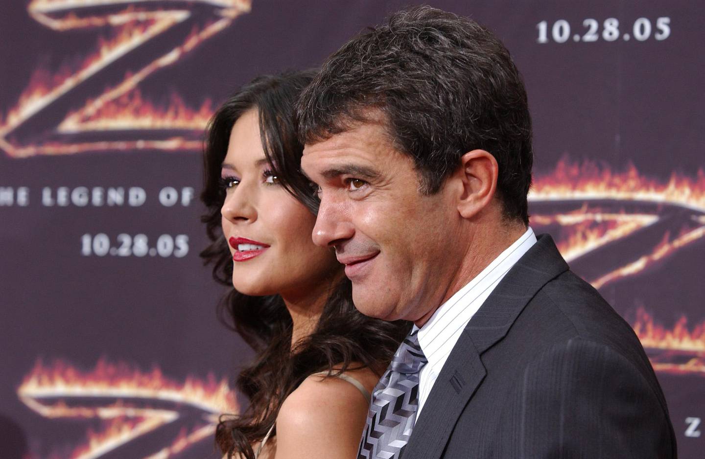 Catherine Zeta-Jones, left, and Antonio Banderas, right, pose for photographers on the red carpet before the premiere of "The Legend of Zorro," on Sunday, Oct. 16, 2005, in downtown Los Angeles. (AP Photo/Rene Macura)                               