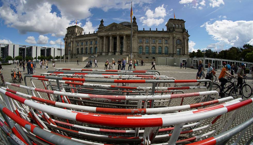 Crowd control barriers are placed in front of the Reichstag building, home of the German federal parliament (Bundestag), in Berlin, Germany, Monday, Aug. 31, 2020. (AP Photo/Michael Sohn)