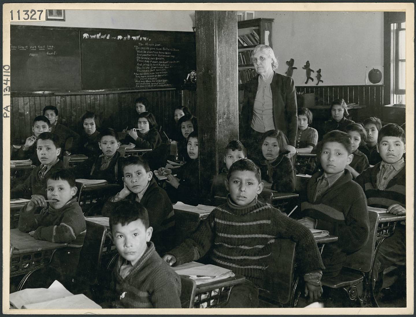 Cree students and teacher in class at All Saints Indian Residential School, (Anglican Mission School)... / Élèves cris et leur professeure au Pensionnat indien de All Saints, (École missionnaire anglicane)...
by BiblioArchives / LibraryArchives