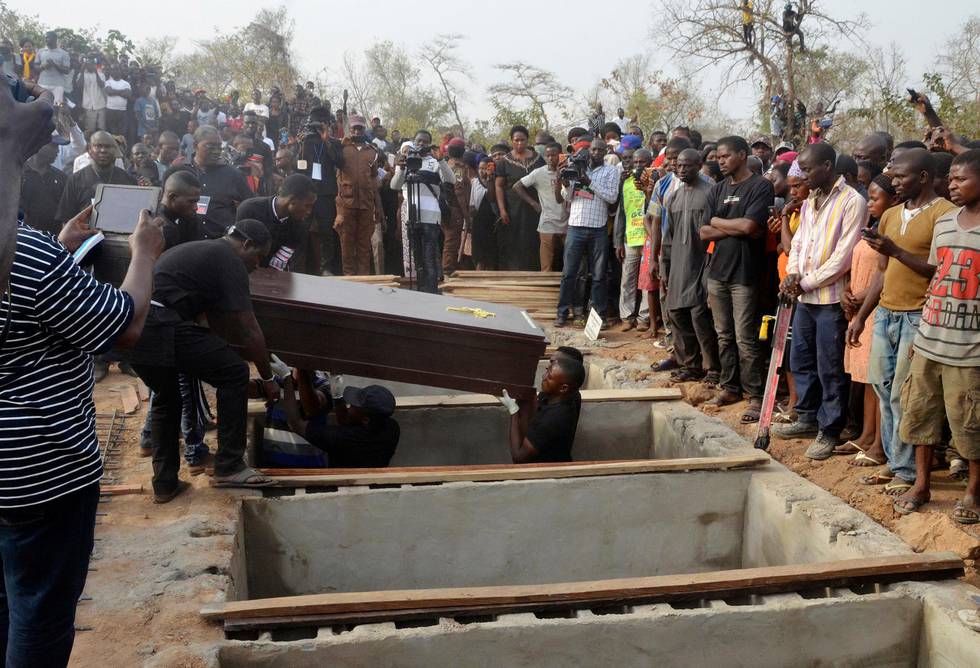 Volunteers handle coffins during a mass funeral for victims of attacks in Makurdi, Nigeria Thursday, Jan. 11, 2018. Mourners have gathered in Nigeria for a mass funeral for more than 70 people killed in a series of attacks blamed on Fulani herdsmen who oppose a new anti-grazing law. (AP Photo)