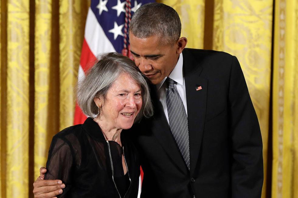 FILE - In this Thursday, Sept. 22, 2016 file photo, President Barack Obama embraces poet Louise Gluck before awarding her the 2015 National Humanities Medal during a ceremony in the East Room of the White House, in Washington. The 2020 Nobel Prize for literature has been awarded to American poet Louise Gluck for her unmistakable poetic voice that with austere beauty makes individual existence universal. The prize was announced Thursday Oct. 8, 2020 in Stockholm by Mats Malm, the permanent secretary of the Swedish Academy. (AP Photo/Carolyn Kaster, File)