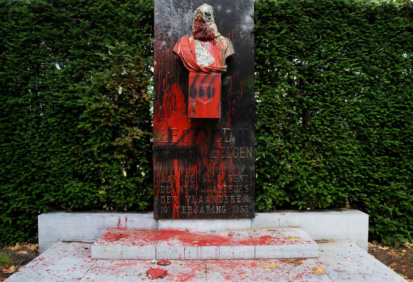 A bust of Belgium's King Leopold II, which has been damaged by red paint, graffiti and cement, at a park in Ghent, Belgium on Friday, June 19, 2020. Protests sweeping the world after George Floyd's death in the U.S. have added fuel to a movement to confront Europe's role in the slave trade and its colonial past. Leopold II is increasingly seen as a stain on the nation where he reigned from 1865 to 1909 with some demonstrators wanting him removed from public view. (AP Photo/Virginia Mayo)
