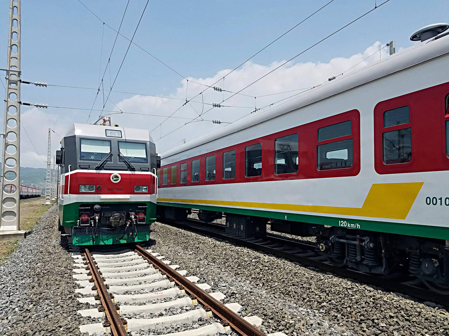 In this photo of Saturday, Sept.24, 2016, locomotives for the new Ethiopia to Djibouti electric railway system queue outside a train station in the outskirts of Addis Ababa. One of Africa's best-performing economies on Wednesday launched its latest massive infrastructure project, a railway linking the landlocked country with a major port on the Gulf of Aden. But it came just days after dozens were killed in anti-government protests in the region the railway runs through. (AP Photo/Elias Meseret)