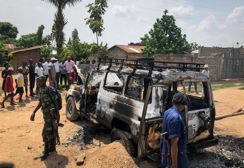 Congolese security forces attend the scene after the vehicle of a health ministry Ebola response team was attacked in Beni, northeastern Congo Monday, June 24, 2019. A driver working with the team is in critical condition after angry crowds hurled rocks at him and set the vehicle on fire, in the latest attack to strike efforts to combat the virus that has killed more than 1,500 people in eastern Congo since the outbreak began last August. (AP Photo/Al-hadji Kudra Maliro)