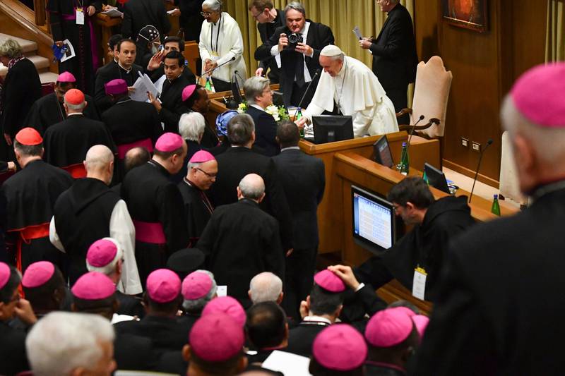 Pope Francis greets bishops as he arrives for a sex abuse prevention summit, at the Vatican, Thursday, Feb. 21, 2019. The gathering of church leaders from around the globe is taking place amid intense scrutiny of the Catholic Church's record after new allegations of abuse and cover-up last year sparked a credibility crisis for the hierarchy. (Vincenzo Pinto/Pool Photo via AP)