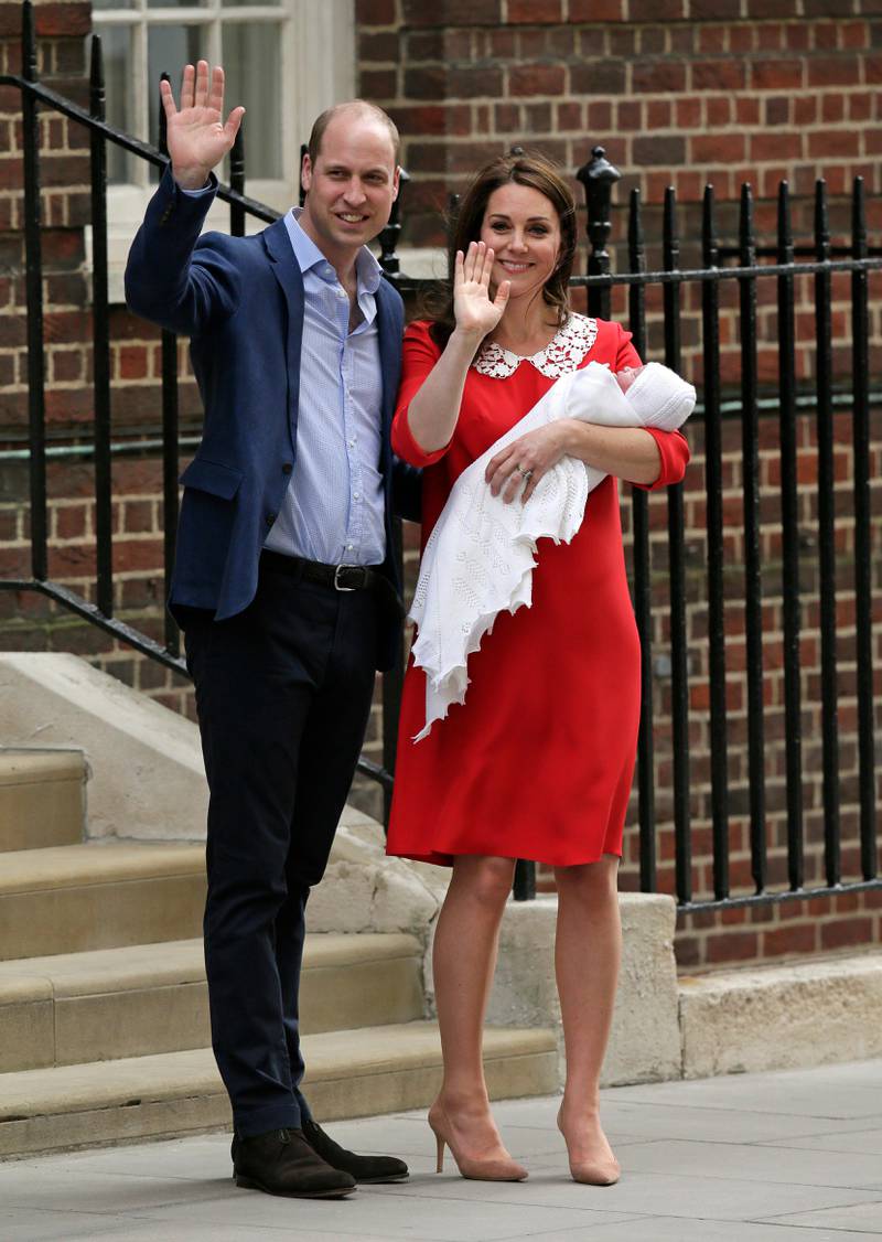 Britain's Prince William and Kate, Duchess of Cambridge wave as they hold their newborn baby son as they leave the Lindo wing at St Mary's Hospital in London London, Monday, April 23, 2018. The Duchess of Cambridge gave birth Monday to a healthy baby boy ?Äî a third child for Kate and Prince William and fifth in line to the British throne. (AP Photo/Tim Ireland)