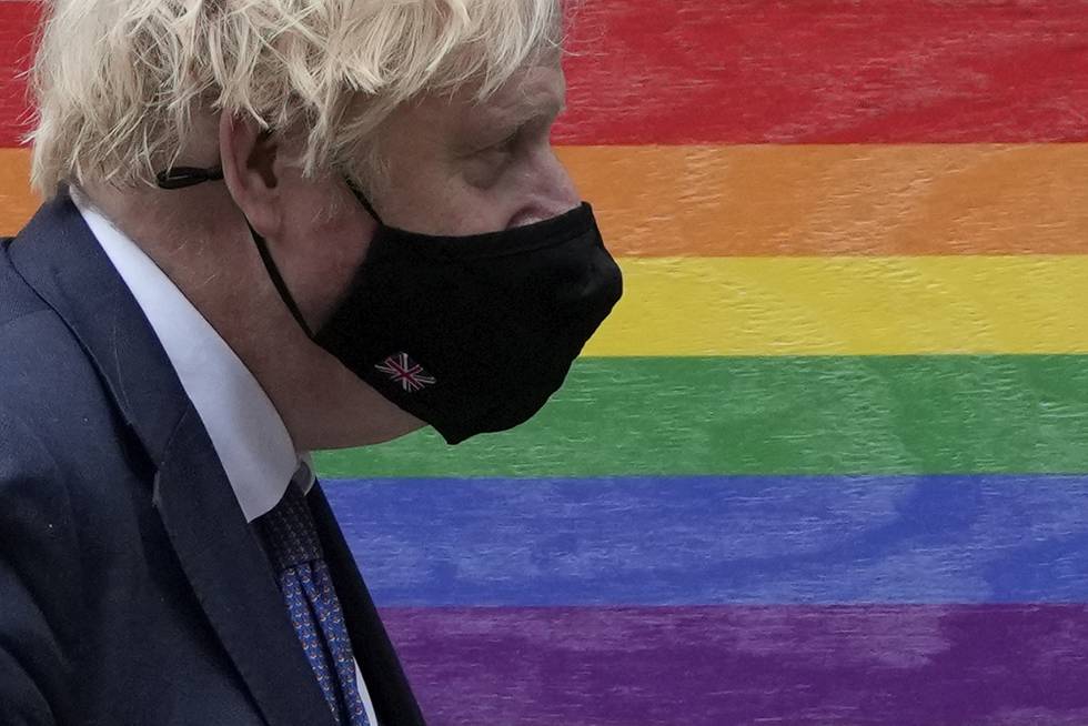 British Prime Minister Boris Johnson leaves 10 Downing Street, with colours displayed around the front door to mark Pride Month, to attend the weekly Prime Minister's Questions at the Houses of Parliament, in London, Wednesday, June 30, 2021. (AP Photo/Matt Dunham)