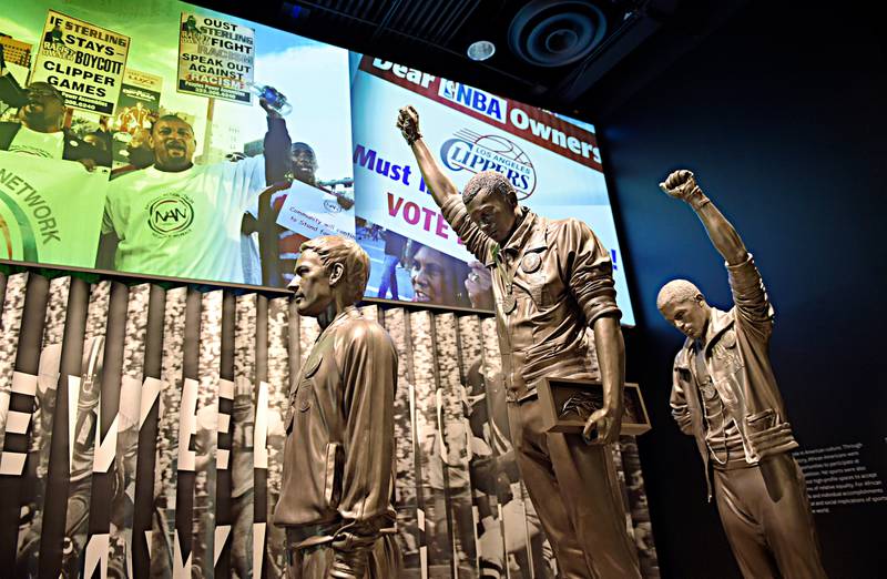 A statue of the 1968 Olympics Black Power salute is on display at the National Museum of African American History and Culture in Washington, Wednesday, Sept. 14, 2016, during a press preview. (AP Photo/Susan Walsh)