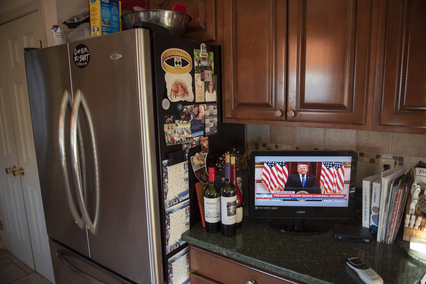Natalie Abbas keeps two televisions on, one tuned to Newsmax and the other to FoxNews, in her home in Myersville, Md., Tuesday, Jan. 19, 2021, the day before the presidential inauguration. As a member of Braver Angels, Abbas, who believes the election was stolen, meets regularly with a neighbor who cheers Biden as the rightful winner, to ponder the greatest challenge facing Biden and American society: how can they find common ground if they no longer exist in the same reality? (AP Photo/Cliff Owen)
