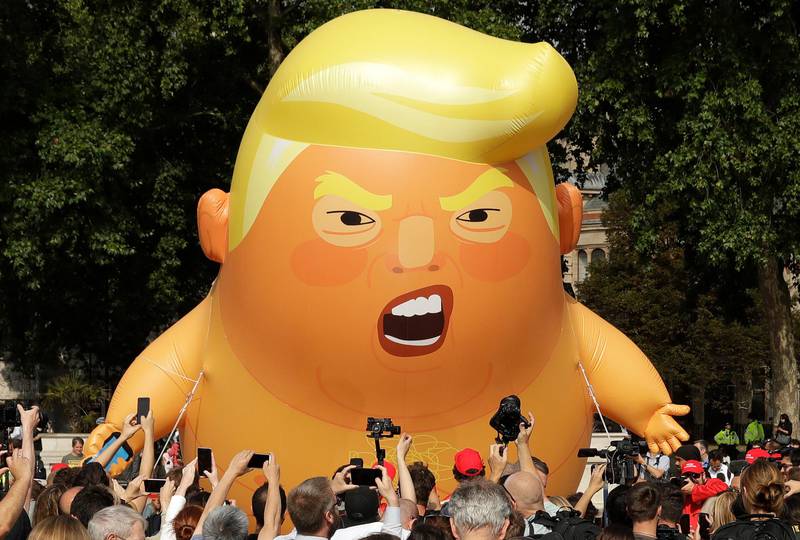 A six-meter high cartoon baby blimp of U.S. President Donald Trump is flown as a protest against his visit, in Parliament Square in London, England, Friday, July 13, 2018. Trump is making his first trip to Britain as president after a tense summit with NATO leaders in Brussels and on the heels of ruptures in British Prime Minister Theresa May's government because of the crisis over Britain's exit from the European Union. (AP Photo/Matt Dunham)