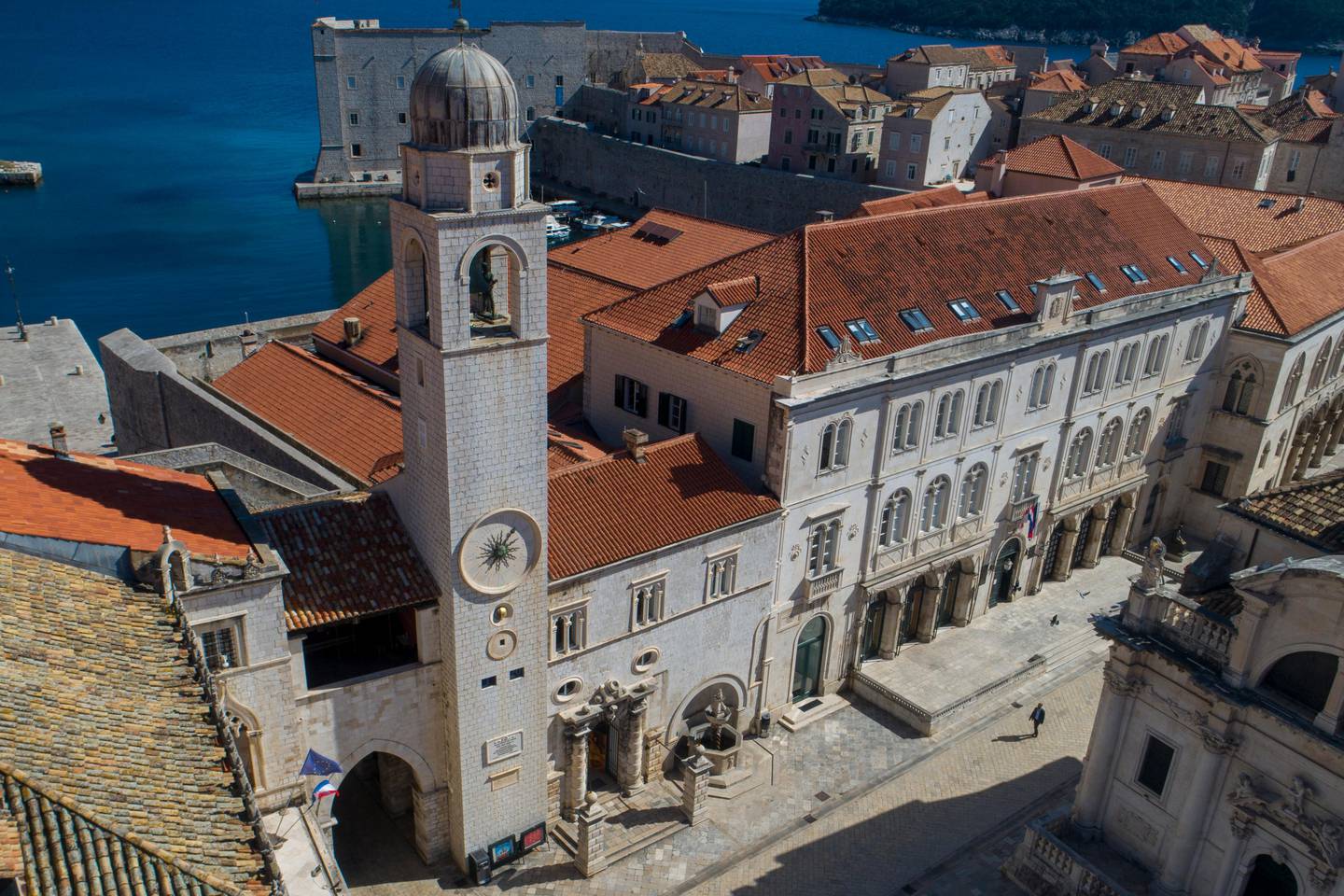 This aerial photo shows a square in the medieval old town of Dubrovnik, Croatia, which would normally be full of tourists and residents, but now is empty due to travel and other restrictions because of the Coronavirus outbreak, Tuesday, March 17, 2020. For most people, the new coronavirus causes only mild or moderate symptoms but for some it can cause more severe illness. (AP Photo/Darko Bandic)
