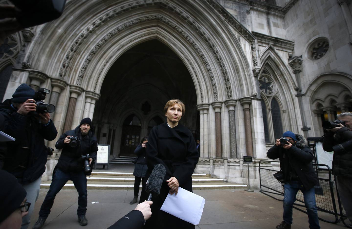 FILE - In this Thursday, Jan. 21, 2016 file photo, Marina Litvinenko, widow of former Russian spy Alexander Litvinenko, reads a statement outside the Royal Courts of Justice in London.  The European Court of Human Rights on Tuesday, Sept. 21, 2021 backed the conclusion of a British inquiry that Russia was responsible for the killing of Alexander Litvinenko, who died in 2006 after drinking tea laced with a radioactive material. A former agent for the KGB and the post-Soviet successor agency FSB, Col. Alexander Litvinenko defected from Russia in 2000 and fled to London. He fell violently ill on Nov. 1, 2006, after drinking tea with two Russian men at a London hotel, and spent three weeks in hospital before he died. His tea was found to have been laced with radioactive polonium-210. (AP Photo/Kirsty Wigglesworth, File)