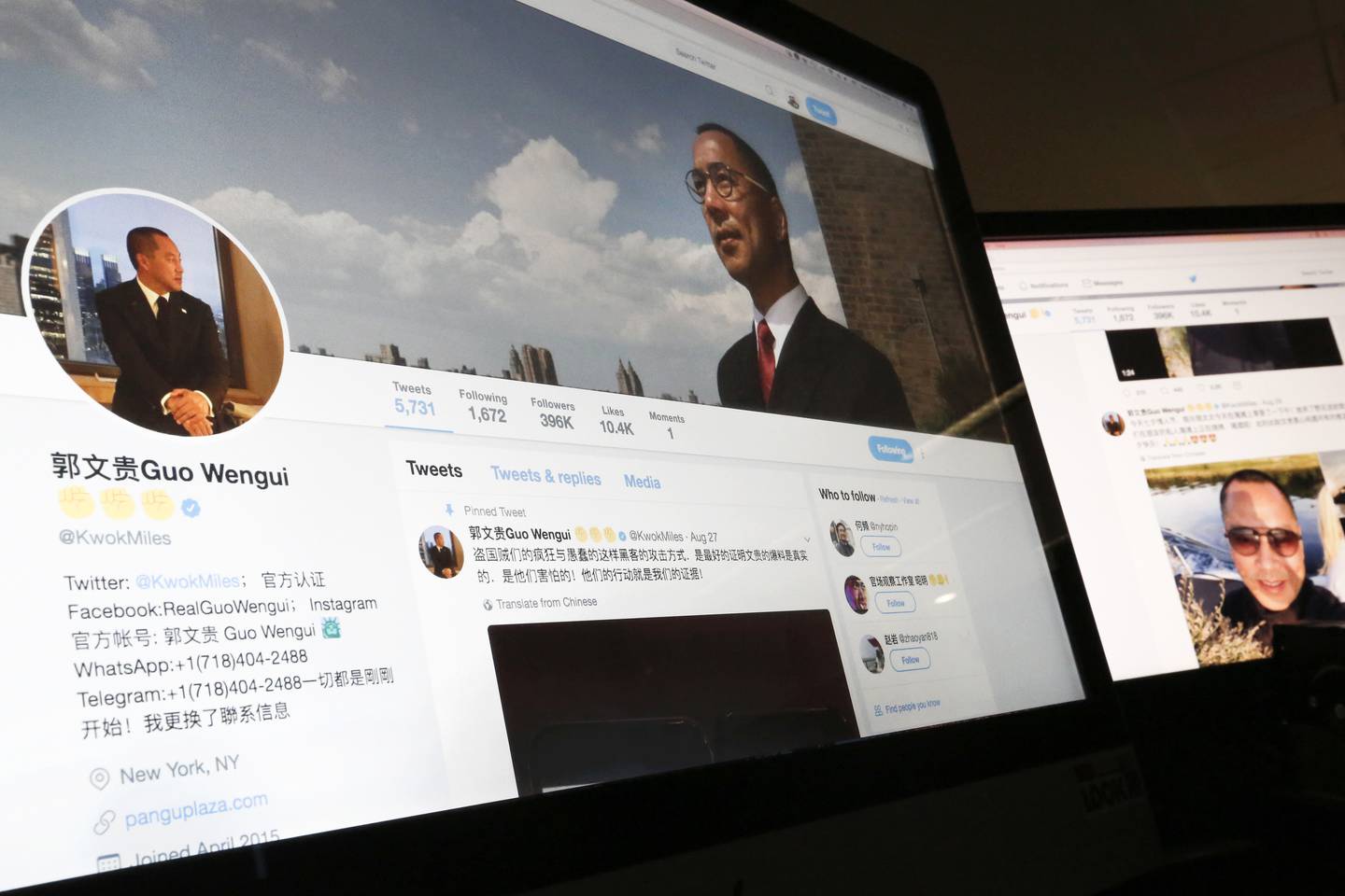 FILE - In this Aug. 30, 2017, file photo, a Twitter page of Chinese exiles businessman Guo Wengui is seen on a computer screen in Beijing.  Chinese real estate tycoon Guo, one of the ruling Communist PartyÄôs most wanted exiles, has applied for political asylum in the United States, his lawyer said Thursday, Sept. 7, in a move that could keep him out of BeijingÄôs grasp for at least several more years. (AP Photo/Andy Wong, File)