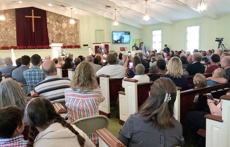 Former President Jimmy Carter speaks at Maranatha Baptist Church on Sunday, May 5, 2019, in Plains, Ga. Democratic presidential candidate Pete Buttigieg and his husband, Chasten Glezman, joined the large crowd at Carter's Sunday school class. At Carter's invitation Buttigieg stood and read from the Bible as part of the lesson at the church. (AP Photo/Jay Reeves)