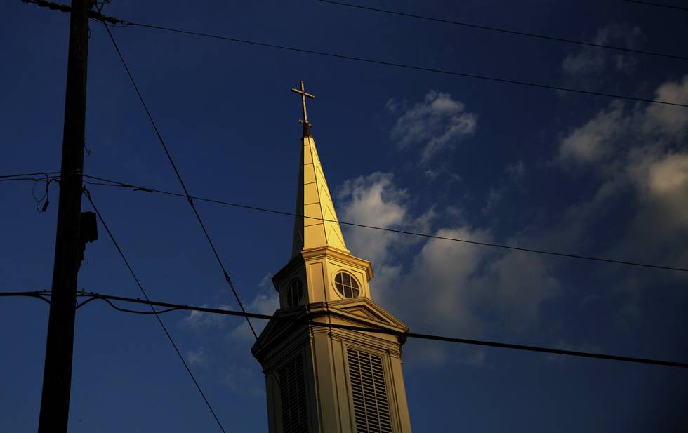 FILE - In this Tuesday, April 11, 2017 file photo, the sun sets on a Baptist church in Georgia.  For the first time since the late 1930s, fewer than half of Americans say they belong to a church, synagogue or mosque, according to a new report from Gallup, Tuesday, March 30, 2021.  (AP Photo/David Goldman)
