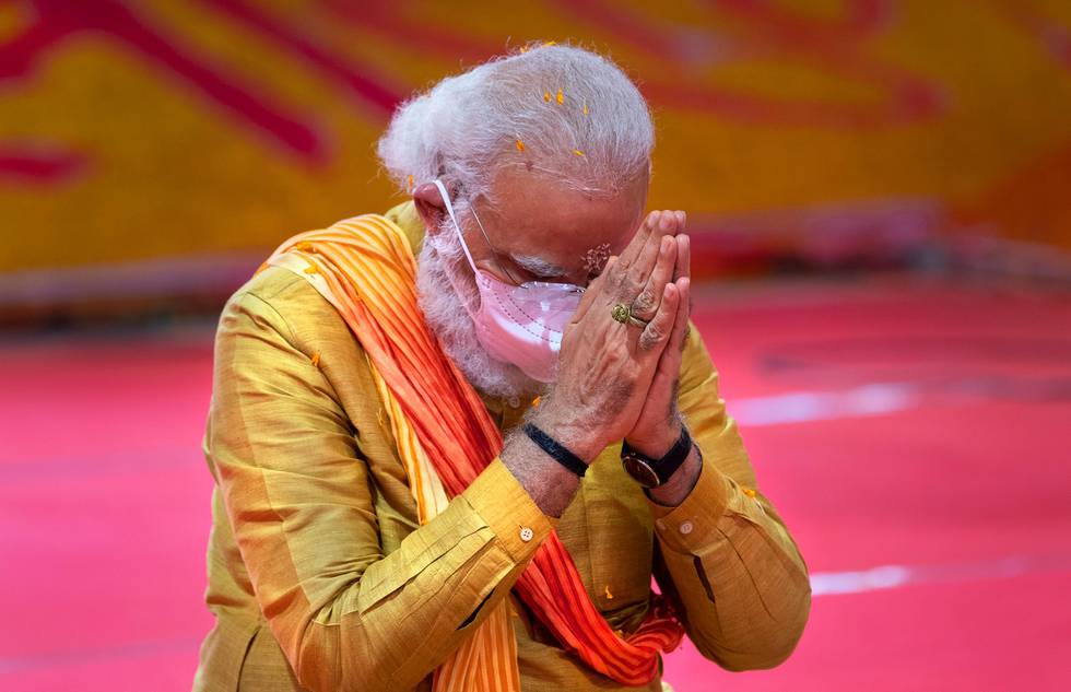 Indian Prime Minister Narendra Modi performs rituals during the groundbreaking ceremony of a temple dedicated to the Hindu god Ram, in Ayodhya, India, Wednesday, Aug. 5, 2020. Hindus rejoiced as Modi broke ground on a long-awaited temple of their most revered god, Ram, at the site of a demolished 16th century mosque. (AP Photo/Rajesh Kumar Singh)