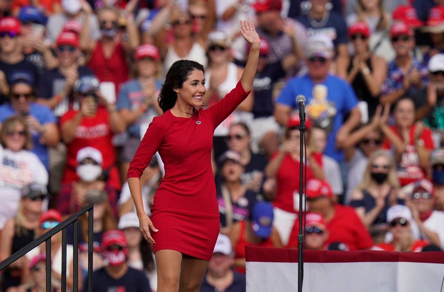 This Oct. 29, 2020 photo shows Anna Paulina Luna, Republican candidate for U.S. House of Representatives waves before President Donald Trump, and First Lady Melania Trump speak at a campaign rally in Tampa, Fla.  Court papers show that Luna is seeking a retraining order against William Braddock whom she accuses of stalking her and wanting her dead. Braddock denies the claims and wants to see any evidence against him. A Pinellas County judge on Tuesday, June 22, 2021,  agreed to delay the matter until July 9.(AP Photo/Chris O'Meara)