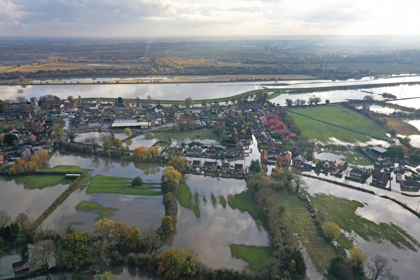 A general view of flooded homes in the village of Fishlake, South Yorkshire, England, Wednesday, Nov. 13, 2019. British Prime Minister Boris Johnson has received a frosty reception in flood-hit areas of northern England after victims of torrential rains lashed out at his slow response in coming to survey the damage.(Richard McCarthy/PA via AP)
