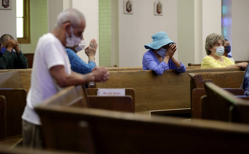 FILE - Parishioners wear face masks as they attend an in-person Mass at Christ the King Catholic Church in San Antonio, Tuesday, May 19, 2020. For the first time in nearly two decades, only half of U.S. households donated to a charity, according to a study released Tuesday, July 27, 2021.  Experts say many factors are contributing to the decline. The percentage of Americans who give to religious causes has decreased in tandem with attendance at worship services as the number of Americans not affiliated with any religion grows.  (AP Photo/Eric Gay, File)