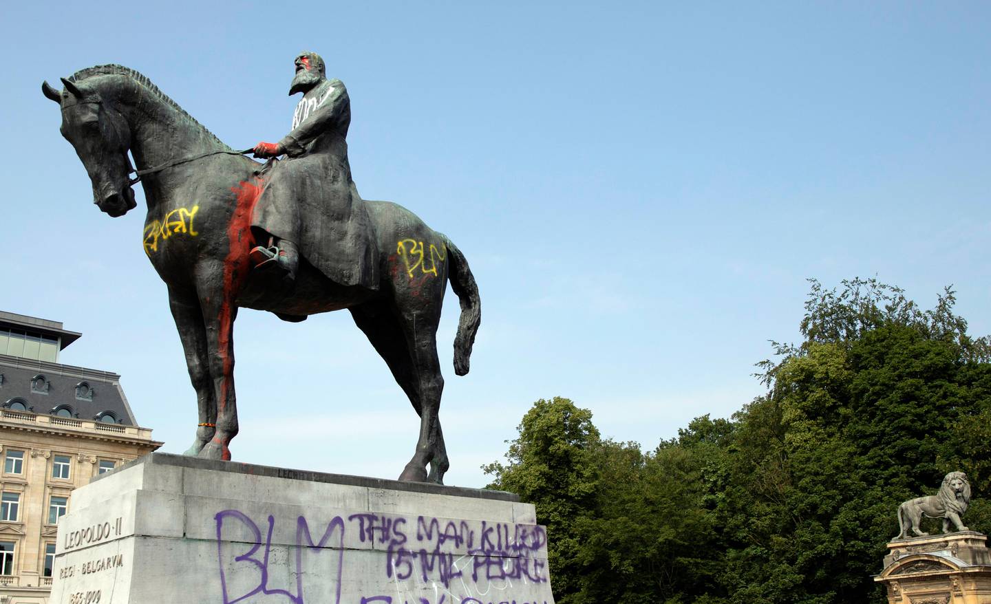FILE - In this Wednesday, June 10, 2020 file photo, a statue of Belgium's King Leopold II is smeared with red paint and graffiti in Brussels. With the protests sweeping the world in the wake of the killing of George Floyd in Minneapolis, King Leopold II is now increasingly seen as a stain on the nation. (AP Photo/Virginia Mayo, File)