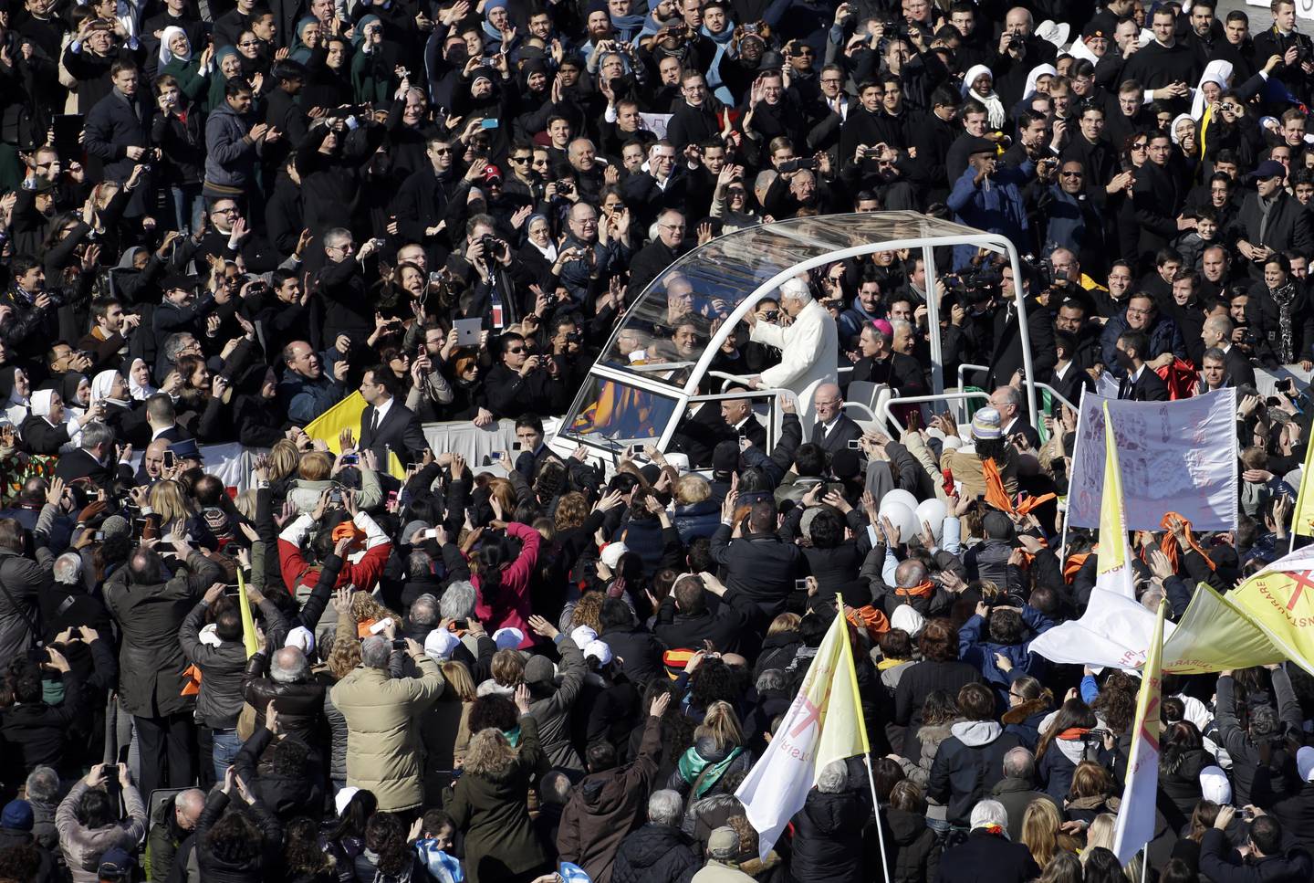 Pope Benedict XVI is driven through the crowd in his pope-mobile as he arrives to celebrate his last general audience in St. Peter's Square, at the Vatican, Wednesday, Feb. 27, 2013. Benedict XVI basked in an emotional sendoff Wednesday at his final general audience in St. Peter's Square, recalling moments of "joy and light" during his papacy but also times of great difficulty. He also thanked his flock for respecting his decision to retire. (AP Photo/Andrew Medichini)