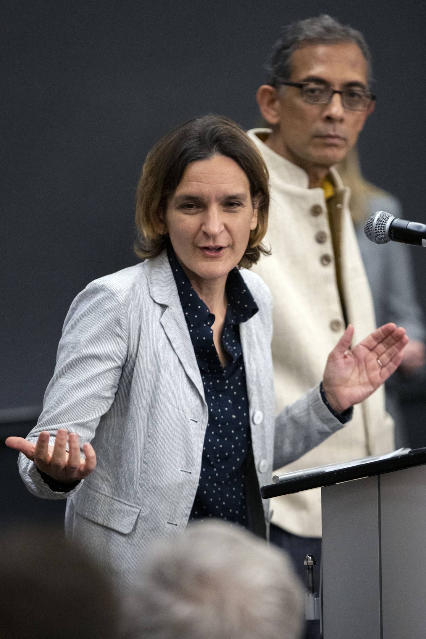 Esther Duflo, left, and Abhijit Banerjee speak during a news conference at Massachusetts Institute of Technology in Cambridge, Mass., Monday, Oct. 14, 2019. Banerjee and Duflo, along with Harvard's Michael Kremer, were awarded the 2019 Nobel Prize in economics for pioneering new ways to alleviate global poverty. (AP Photo/Michael Dwyer)