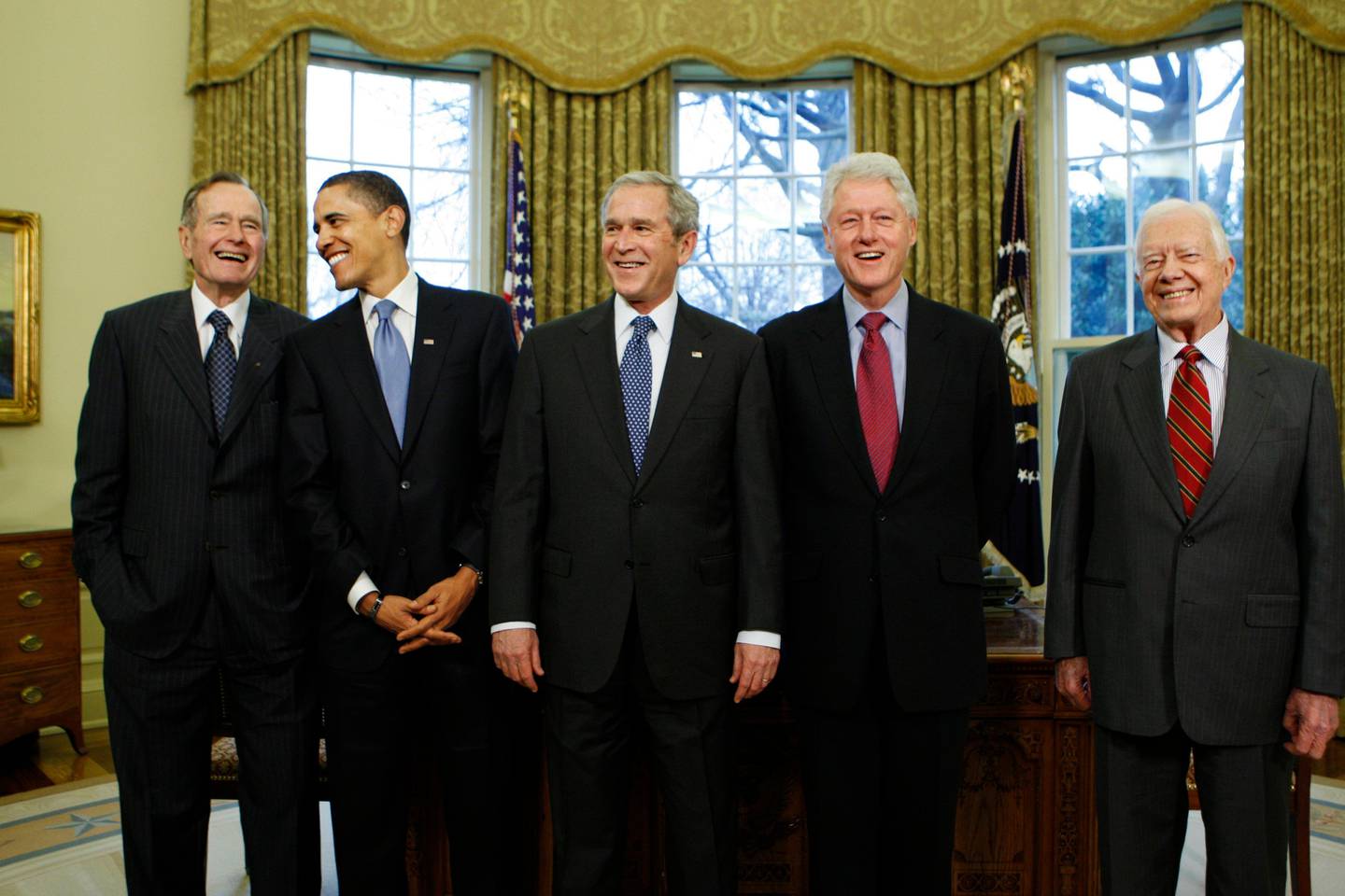 FILE - In this Wednesday, Jan. 7, 2009 file photo, President-elect Barack Obama is welcomed by President George W. Bush for a meeting at the White House in Washington, with former presidents, from left, George H.W. Bush, Bill Clinton and Jimmy Carter. On Friday, May 15, 2020, The Associated Press reported on stories circulating online incorrectly asserting that Obama is the first president to speak out against his successor. Several former presidents have made comments criticizing the policies of their successors, including George W. Bush, Bill Clinton, Jimmy Carter _ even Theodore Roosevelt. (AP Photo/J. Scott Applewhite)