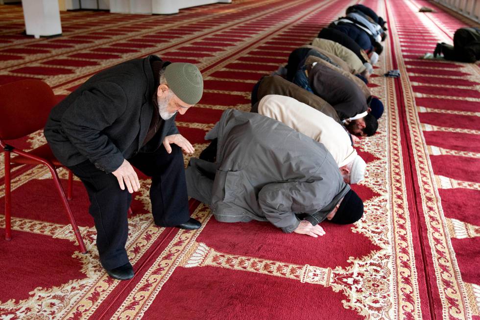  Muslim worshippers pray in the prayer hall of the Polder Mosque in Amsterdam, Netherlands, Thursday, Feb. 18, 2010. Uniquely in the Netherlands, men and women pray together in the Polder mosque, albeit segregated, with the women praying in the back of the prayer hall. Devotions and sermons are conducted mostly in Dutch rather than Arabic. And non-Muslims are welcome. Across Europe Muslims are seeking a formula that lets them be an inseparable part of their country while maintaining their loyalty to their faith and origin. (AP Photo/ Evert Elzinga)