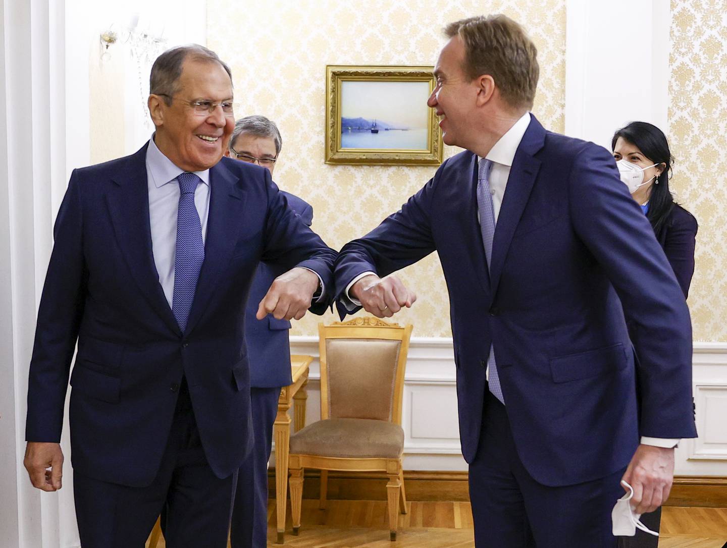 In this photo released by the Russian Foreign Ministry Press Service, Russian Foreign Minister Sergey Lavrov, left, and President of the World Economic Forum Borge Brende greet each other prior to their talks in Moscow, Russia, Friday, Dec. 18, 2020. (Russian Foreign Ministry Press Service via AP)