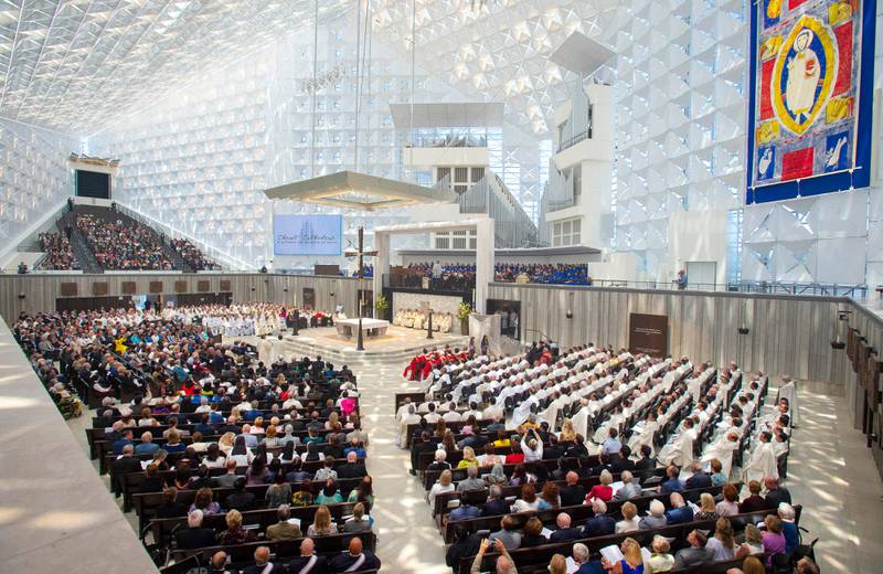 Guests attend the Christ Cathedral Solemn Mass of Dedication on Wednesday July 17, 2019, in Garden Grove, Calif. More than 2,000 guests attended the event that marked the opening of the building, now known as Christ Cathedral, the new home of the Diocese of Orange. The landmark was long known as Rev. Robert H. Schuller's Crystal Cathedral. (Mark Rightmire/The Orange County Register via AP)