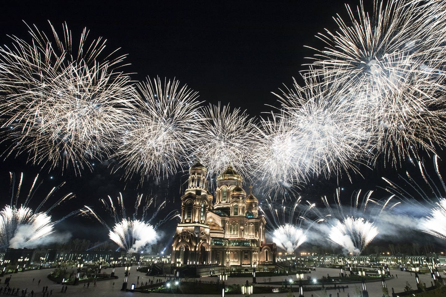 Fireworks explode over the Cathedral of Russian Armed Forces during the Spasskaya Tower military music festival in Kubinka, outside Moscow, Russia, Sunday, Sept. 6, 2020. Due to coronavirus, the annual international music festival in Red Square was canceled, an online festival without spectators took place Sunday on the Cathedral Square in Patriot Park, outside Moscow. (AP Photo/Pavel Golovkin)