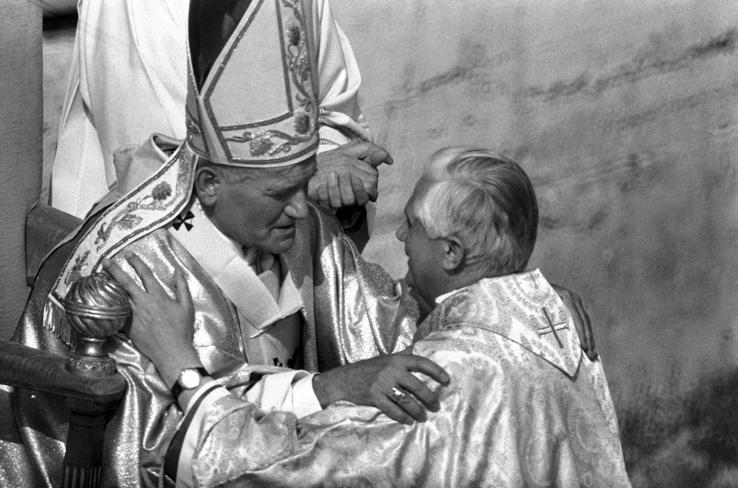FILE - Pope John Paul II places his hands on the shoulders of West German Cardinal Joseph Ratzinger, archbishop of Munich and Freising, on Oct. 22, 1978, during the solemn inauguration of his ministry as universal Pastor of the Church in Vatican City. As John Paul’s right-hand man on doctrinal matters, Ratzinger wrote documents reinforcing church teaching opposing homosexuality, abortion and euthanasia, and asserting that salvation can only be found in the Catholic Church. Pope Emeritus Benedict XVI, the German theologian who will be remembered as the first pope in 600 years to resign, has died, the Vatican announced Saturday Dec. 31, 2022. He was 95. (AP Photo, File)